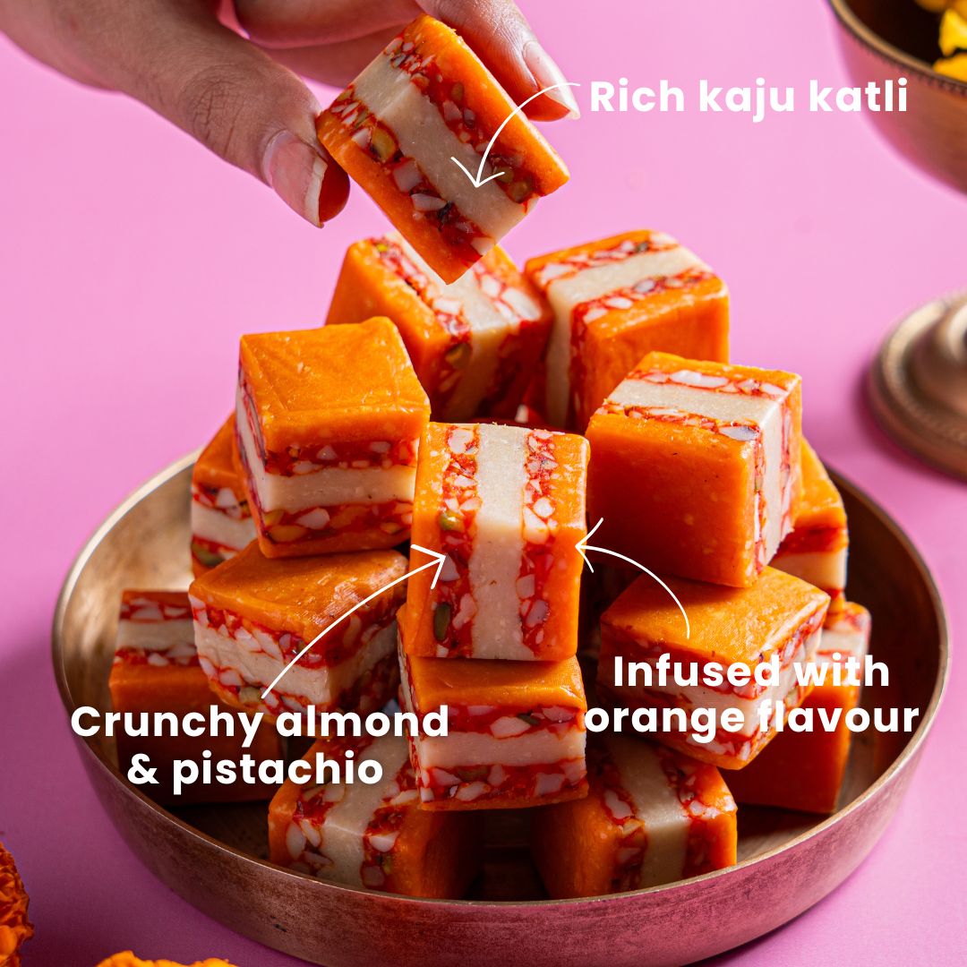 Rich Kaju Katli with crunchy almond and pistachio, infused with orange flavour.