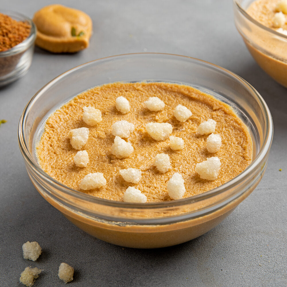 Nolen Gud Sandesh in a bowl topped with crunchy Gond.