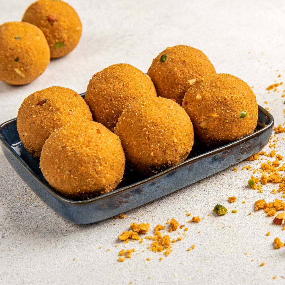 Beautifully crafted traditional Besan Laddus sitting on a tray