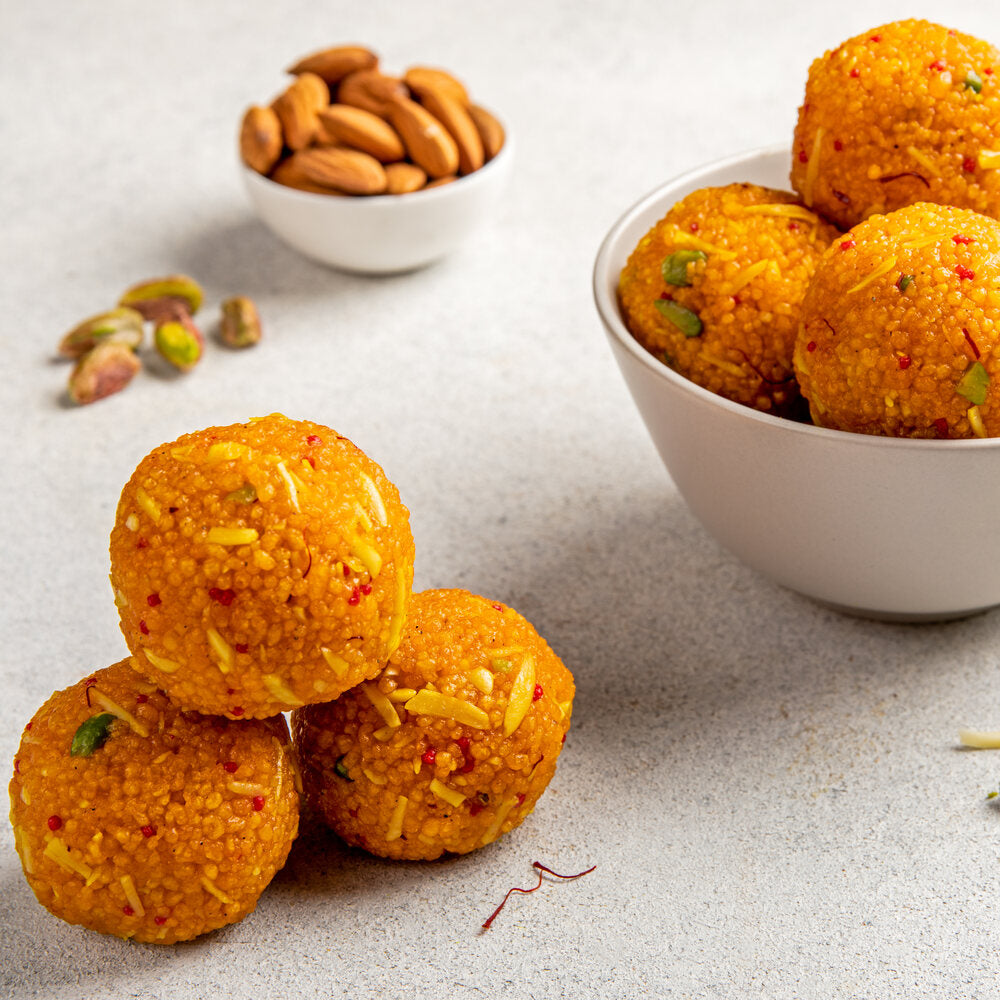 Beautifully crafted Kesaria Boondi Laddu, featuring golden Boondi pearls, aromatic saffron, and dry fruits