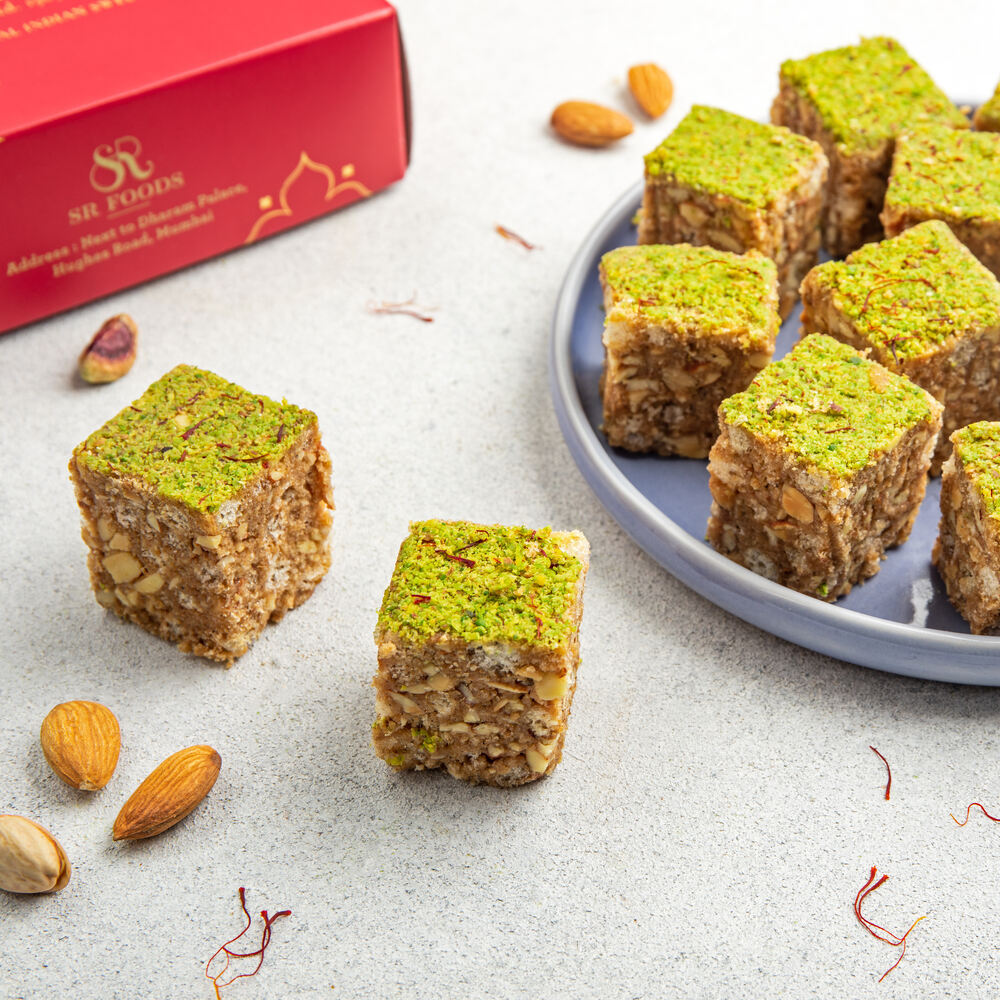 Beautifully crafted gond barfi pieces adorned with slivers of pistachio and saffron