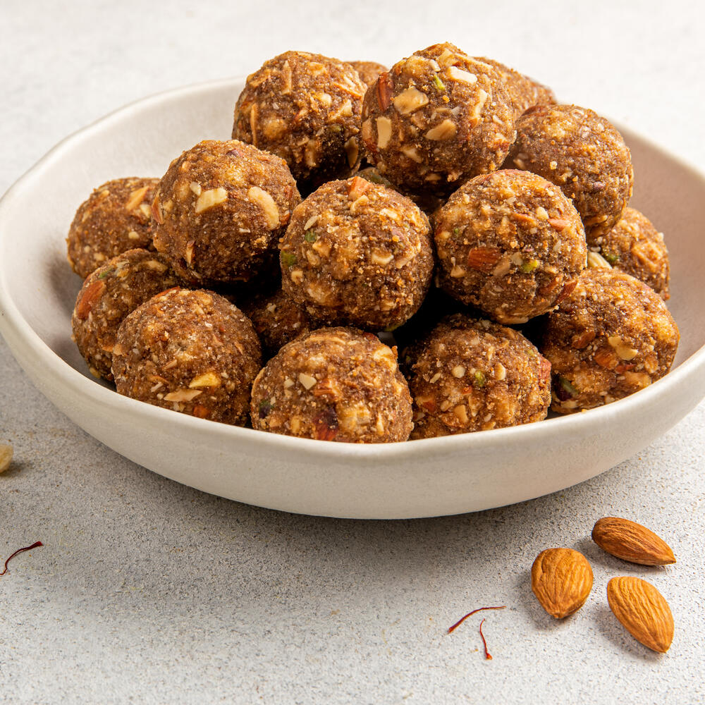 Beautifully crafted gond gud laddus in a bowl.