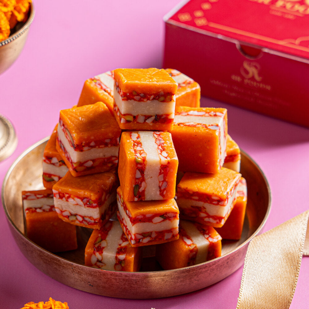 Rich Kaju Katli with crunchy nuts, infused with orange flavour.