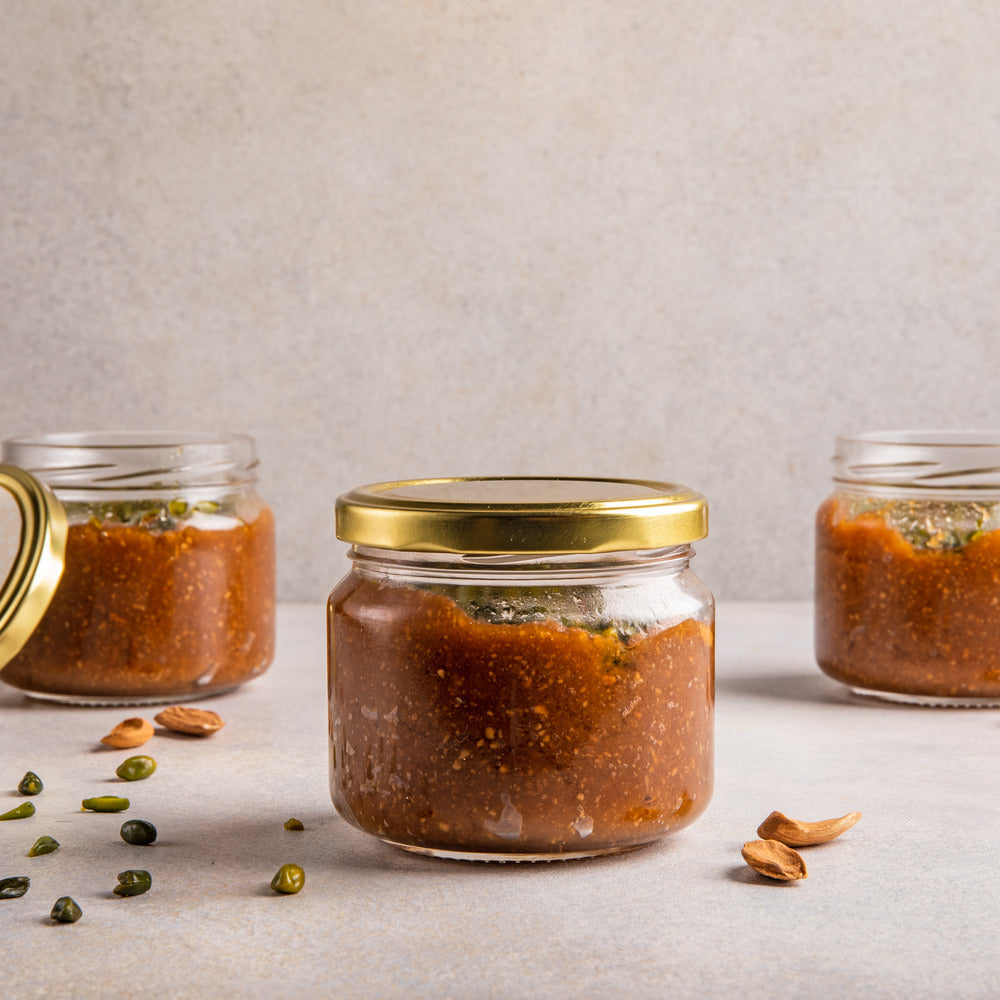 Jar with mamra badam seera, creating a visually appealing dessert presentation.