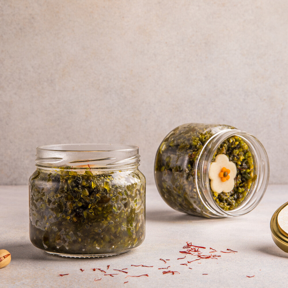Jar with pishori pista seera, creating a visually appealing dessert presentation