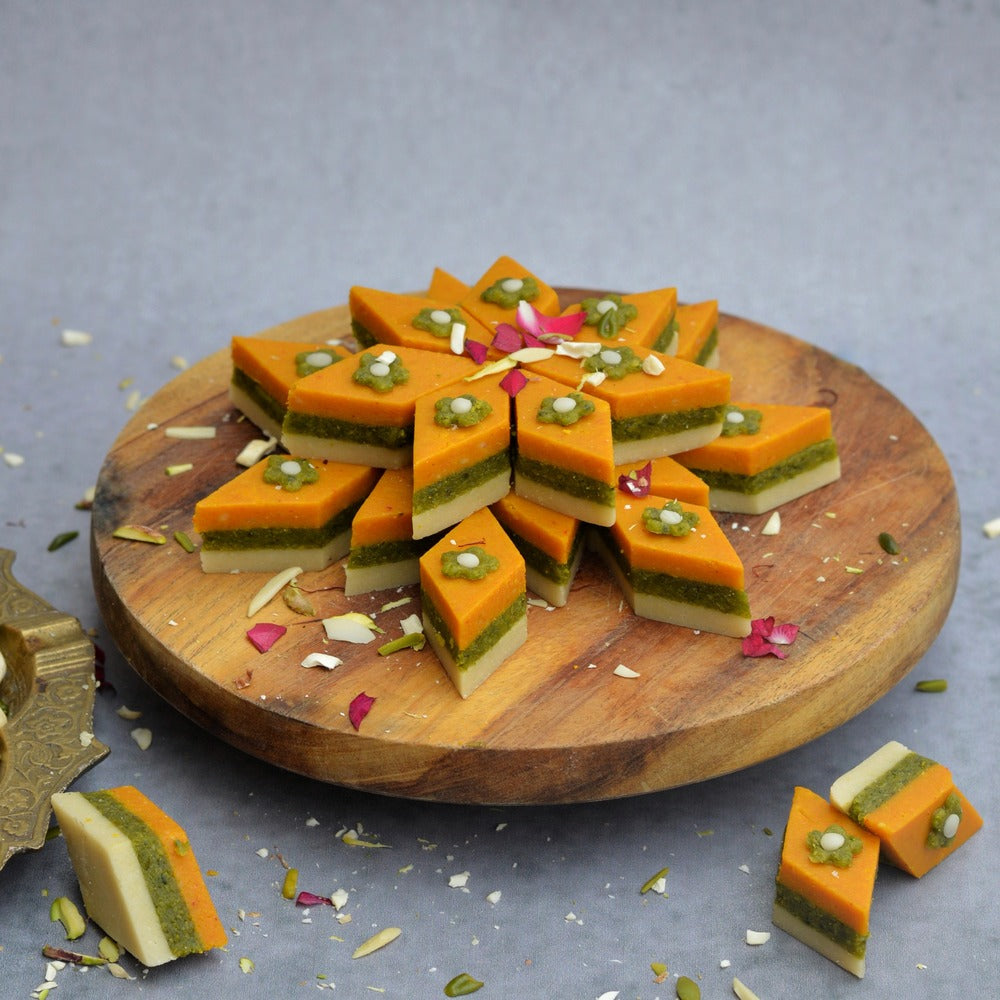Layers of Kaju Saffron, Pistachio and classic Kaju designed in the shape of a Katli